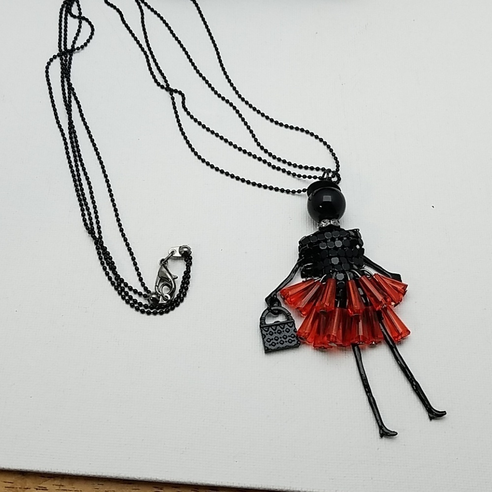 Beaded Lady Red Skirt Carrying a Purse 24" Black